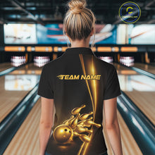 Load image into Gallery viewer, Back view of a female model in a bowling lane wearing a black quarter-zip shirt featuring golden bowling ball and pins design with dynamic bowling visuals.