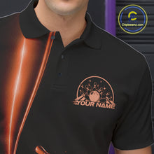 Load image into Gallery viewer, Close up left chest of bowling polo shirt, black fabric featuring orange bowling ball and pins emblem, detailed apparel branding perspective
