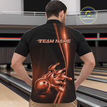 Load image into Gallery viewer, Front view of a male model in a bowling lane wearing a black quarter-zip shirt featuring orange bowling ball and pins design with bold sports styling.