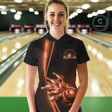 Load image into Gallery viewer, Front view of a female model in a bowling lane wearing a black quarter-zip shirt with orange bowling ball and pins design and clean sporty visuals.