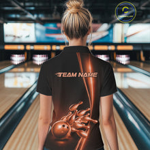 Load image into Gallery viewer, Back view of a female model in a bowling lane wearing a black quarter-zip shirt featuring orange bowling ball and pins design with dynamic bowling action graphics.