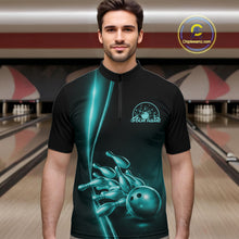 Load image into Gallery viewer, Front view of a male model in a bowling lane wearing a black quarter-zip shirt with turquoise blue bowling ball and pins design and sporty bowling visuals.