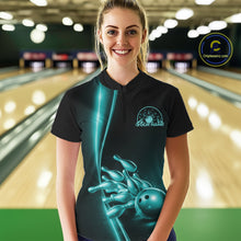 Load image into Gallery viewer, Front view of a female model in a bowling lane wearing a black quarter-zip shirt with turquoise blue bowling ball and pins design and athletic bowling visuals.