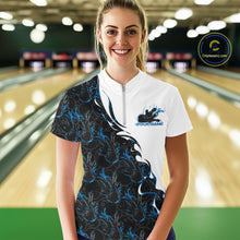 Load image into Gallery viewer, Front view of a female model in a bowling lane wearing a white quarter-zip shirt with blue and black flame bowling pattern and dynamic bowling action design.