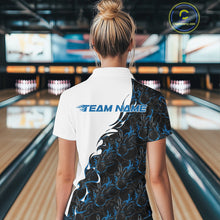 Load image into Gallery viewer, Back view of a female model in a bowling lane wearing a white quarter-zip shirt featuring blue and black flame bowling pattern with sporty athletic graphics.
