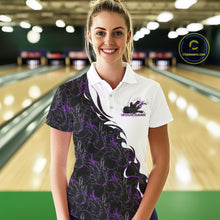 Load image into Gallery viewer, Front view of a female model in a bowling lane wearing a white polo shirt with purple and black flame bowling pattern and dynamic bowling action graphics.