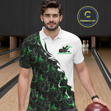 Load image into Gallery viewer, Front view of a male model in a bowling lane wearing a white polo shirt with green and black flame bowling pattern and dynamic bowling visuals.