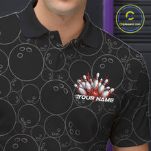 Load image into Gallery viewer, Close-up view of the left chest of a black bowling polo shirt showing bowling ball pattern with vibrant red flames rising and detailed bowling artwork.