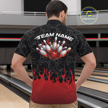Load image into Gallery viewer, Male model inside a bowling venue wearing black quarter zip shirt, front view featuring bowling ball pattern with red flames rising and striking bowling action graphics