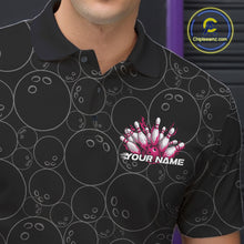 Load image into Gallery viewer, Close-up view of the left chest of a black bowling polo shirt showing bowling ball pattern with vibrant pink flames rising and detailed bowling artwork.