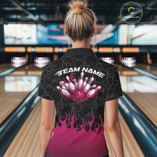 Load image into Gallery viewer, Back view of a female model in a bowling lane wearing a black polo shirt featuring vibrant pink flames and bowling ball pattern with dynamic sports styling.