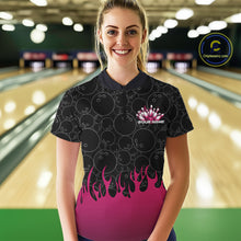 Load image into Gallery viewer, In a bowling lane, front view of a female model wearing a black quarter-zip shirt with vibrant pink flames and bowling ball pattern graphics creating a bold bowling action scene.