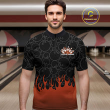 Load image into Gallery viewer, Male model in a bowling lane wearing black quarter zip shirt, front view featuring orange flames rising with bowling ball pattern and energetic sports design