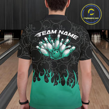 Load image into Gallery viewer, Back view of a male model in a bowling lane wearing a black polo shirt with vibrant turquoise green flames rising and bowling ball pattern with flaming bowling design.