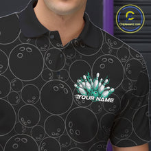 Load image into Gallery viewer, Close-up view of the left chest of a black bowling polo shirt featuring bowling ball pattern with vibrant turquoise green flames rising from the bottom.