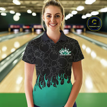Load image into Gallery viewer, Front view of a female model in a bowling lane wearing a black polo shirt featuring bowling ball pattern with vibrant turquoise green flames rising from the bottom and dynamic flaming bowling graphics.