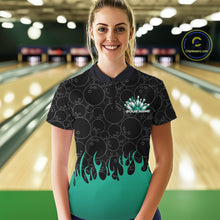 Load image into Gallery viewer, In a bowling lane, front view of a female model wearing a black bowling quarter-zip shirt with vibrant turquoise flames, showcasing flaming bowling ball action graphics.