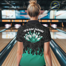 Load image into Gallery viewer, Inside a bowling lane, back view of a female model wearing a black bowling quarter-zip shirt with vibrant turquoise flames, featuring flaming bowling ball action artwork.