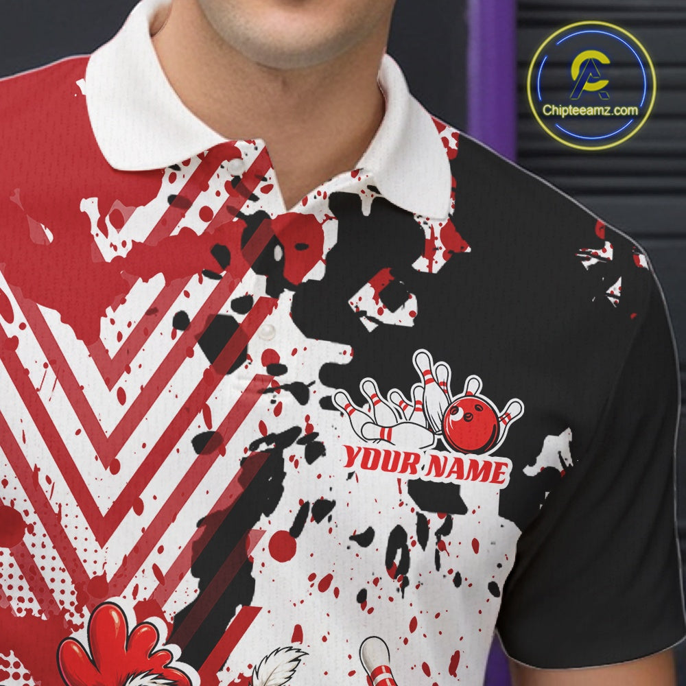 A close-up of a person wearing a short-sleeve polo shirt with a bold red, black, and white abstract splatter design. The shirt features a white collar, a bowling pin and ball graphic on the chest, and the text 'YOUR NAME' in red.