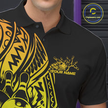 Load image into Gallery viewer, Close-up of the left chest on a black and gold bowling polo shirt featuring tribal-framed bowling artwork.
