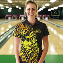 Load image into Gallery viewer, Female model wearing a black and gold bowling polo shirt at the lane with Polynesian-style bowling details.