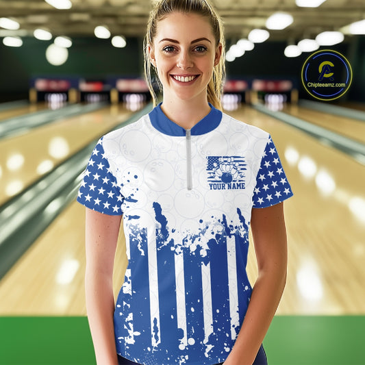 Female bowling team matching in personalized blue patriotic US flag quarter-zip jerseys at the lanes.