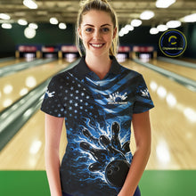 Load image into Gallery viewer, Female model wearing a black bowling polo shirt at the lane with blue flame bowling graphics and patriotic-inspired accents.