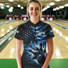 Load image into Gallery viewer, Female model wearing a black bowling quarter-zip shirt at the lane with blue flame bowling strike artwork and patriotic flag details.