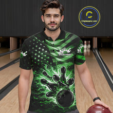 Load image into Gallery viewer, Male model wearing a black bowling polo shirt at the bowling lane with green flame bowling artwork and patriotic accents.