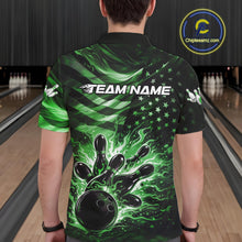 Load image into Gallery viewer, Back view of a male model in a black bowling polo shirt featuring green flame bowling strike graphics and distressed flag motifs.