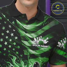 Load image into Gallery viewer, Left chest close-up of a black bowling polo shirt displaying green flame bowling artwork and flag-themed details.