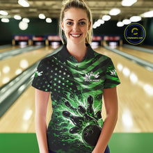 Load image into Gallery viewer, Female model wearing a black bowling polo shirt at the bowling lane with green flame bowling artwork and distressed American flag accents.