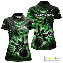 Load image into Gallery viewer, Front and back views of a black womens bowling polo shirt showcasing a green flame bowling ball striking pins with patriotic flag-inspired graphics.