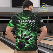 Load image into Gallery viewer, Front view of a male model in a black bowling quarter-zip shirt displaying green flame bowling strike artwork and flag accents.
