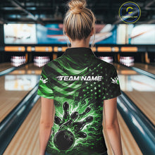Load image into Gallery viewer, Back view of a female model in a black bowling quarter-zip shirt featuring green flame bowling graphics and a distressed American flag theme.
