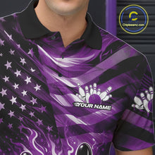Load image into Gallery viewer, Close-up of the left chest on a black bowling polo shirt featuring purple flame bowling artwork and distressed flag details.