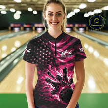Load image into Gallery viewer, Female model wearing a black bowling quarter-zip shirt at the lane with pink flame bowling graphics and distressed flag accents.