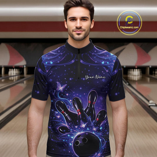 Male model in a blue and purple bowling quarter-zip shirt at the lane with glowing butterfly graphics.