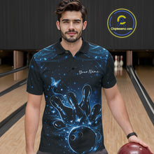 Load image into Gallery viewer, Male model wearing a black and blue bowling polo shirt at the bowling lane with glowing butterfly bowling motifs.