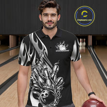 Load image into Gallery viewer, Male model seen from the front in a bowling lane wearing a black polo shirt featuring a silver metal tribal flame bowling ball striking pins in a dynamic sports action scene.