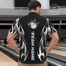Load image into Gallery viewer, Bowling center scene with male model wearing black quarter zip shirt featuring silver tribal flame bowling ball striking pins in energetic motion design.