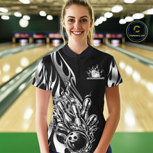 Load image into Gallery viewer, Female model front view at bowling lane wearing black quarter zip shirt with silver metal tribal flame bowling ball hitting pins design