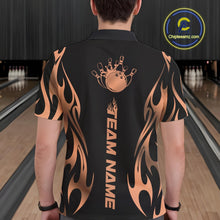 Load image into Gallery viewer, Male model seen from the back in a bowling lane wearing a black polo shirt featuring a rose gold gradient tribal flame bowling ball striking pins in a dynamic motion design.