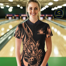 Load image into Gallery viewer, Female model front view inside bowling center wearing black quarter zip shirt with rose gold tribal flame bowling ball striking pins artwork