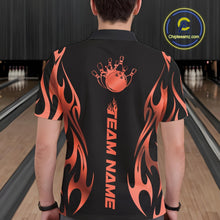 Load image into Gallery viewer, Male model seen from the back in a bowling lane wearing a black polo shirt featuring a red gradient tribal flame bowling ball striking pins in a bold sports illustration.
