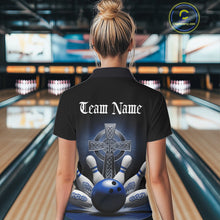 Load image into Gallery viewer, Back view female model at bowling alley wearing black polo shirt with blue Celtic cross and dynamic bowling strike graphic