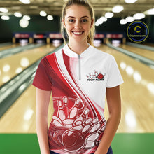 Load image into Gallery viewer, Female model at the bowling lane wearing a white and red bowling quarter zip featuring sweeping curve graphics and a bowling ball crashing into pins motif.