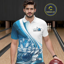 Load image into Gallery viewer, Male model in a bowling lane wearing a white and blue polo shirt with curved bowling ball hitting pins design and motion effects.