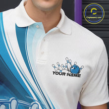 Load image into Gallery viewer, Close-up of the left chest area of a white and blue bowling polo shirt, featuring a dynamic curved bowling action graphic.