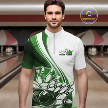 Load image into Gallery viewer, Male model in a bowling alley wearing a white and green quarter zip shirt with a dynamic curved graphic of a bowling ball hitting pins.